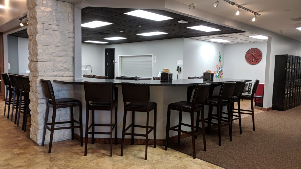 cafeteria area set up with chairs next to a counter top where students can hang out